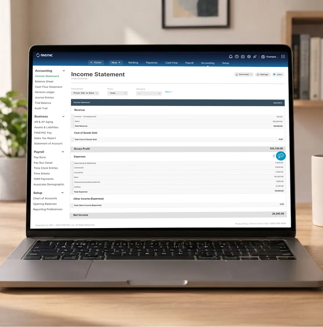 FINSYNC income statement displayed on a laptop