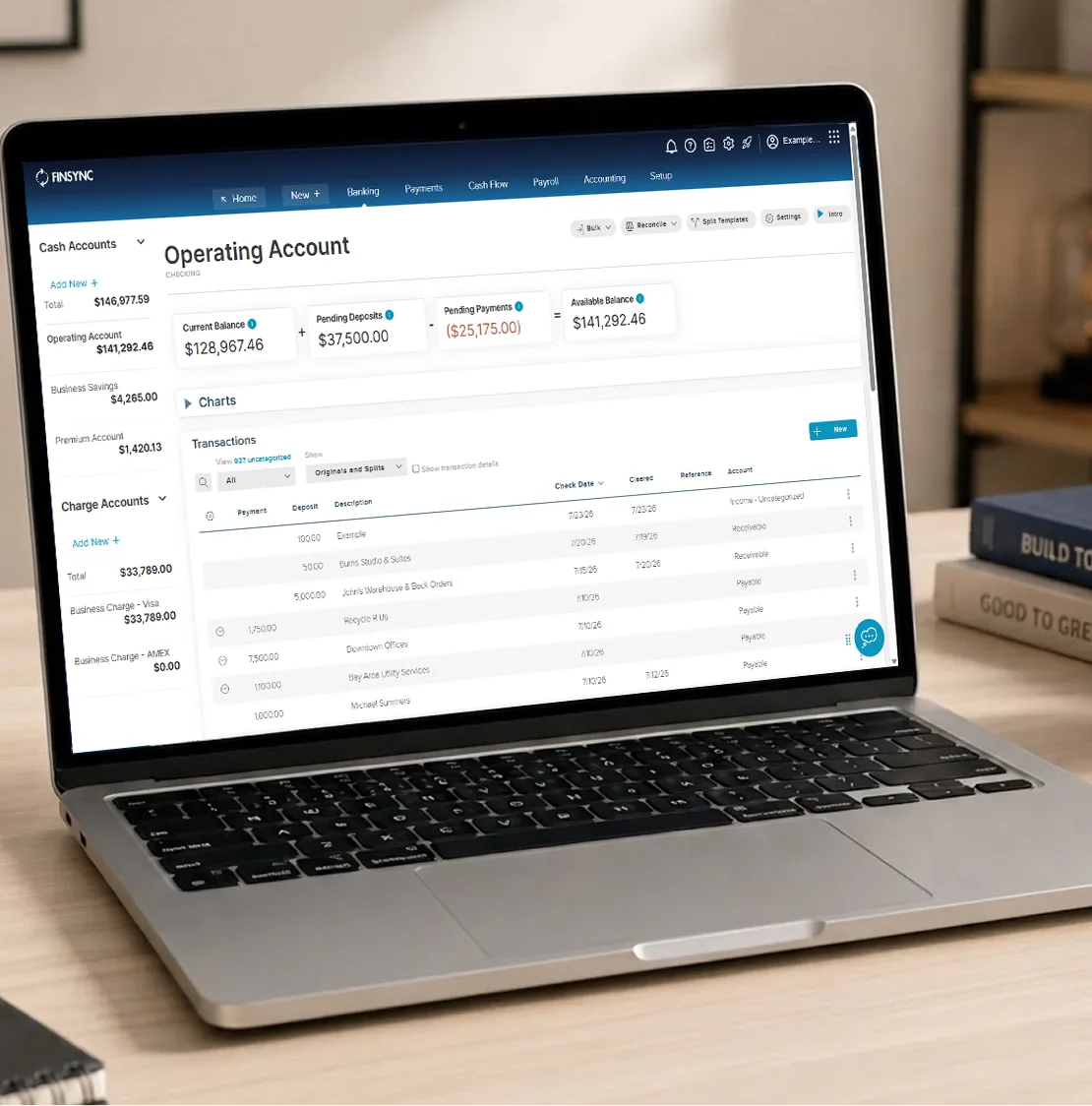FINSYNC banking dashboard displayed on a laptop