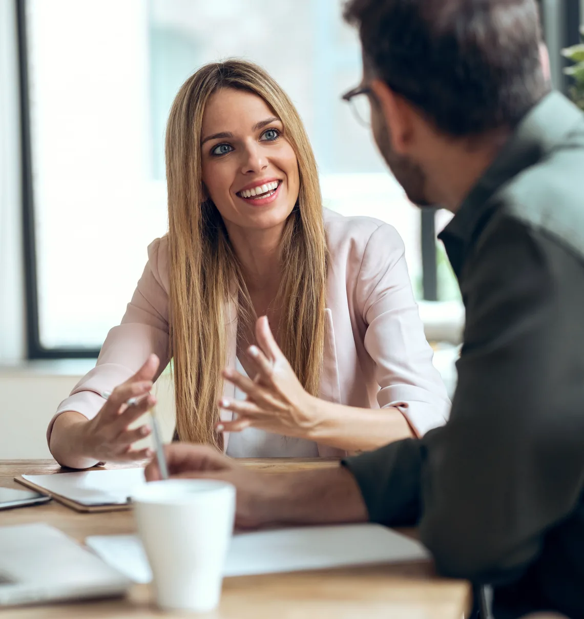A business owner talking through her numbers with a coach