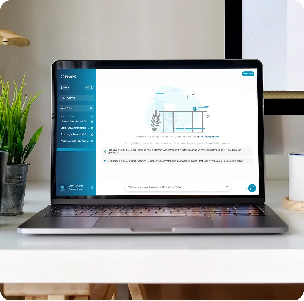 A business owner planning at a laptop