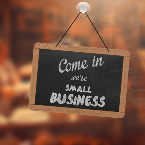 A sign on a door that says "come in we are a small business"