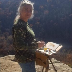 Amber Leibee Owner of Adventure Art Painting in the beautiful mountains