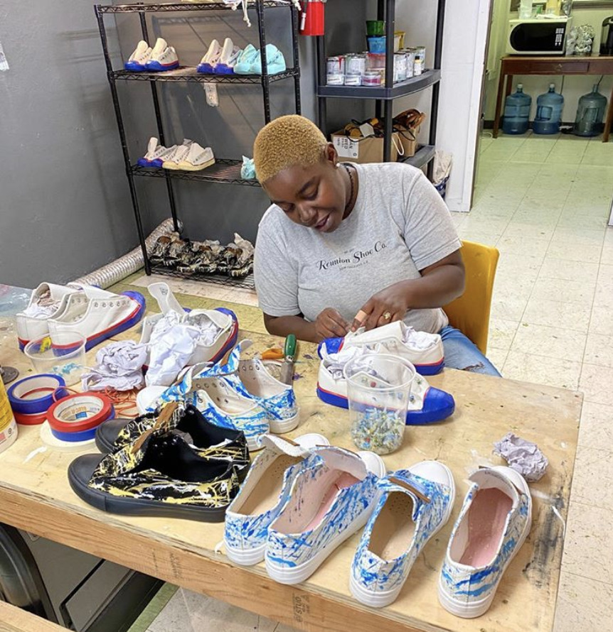Kenesha an Employee at Reunion Shoe Co is making shoes