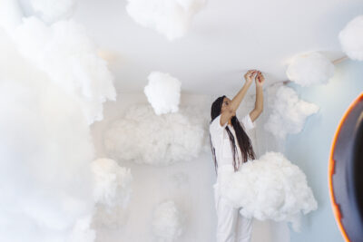 MEMFOLK owner hanging cotton clouds from the ceiling