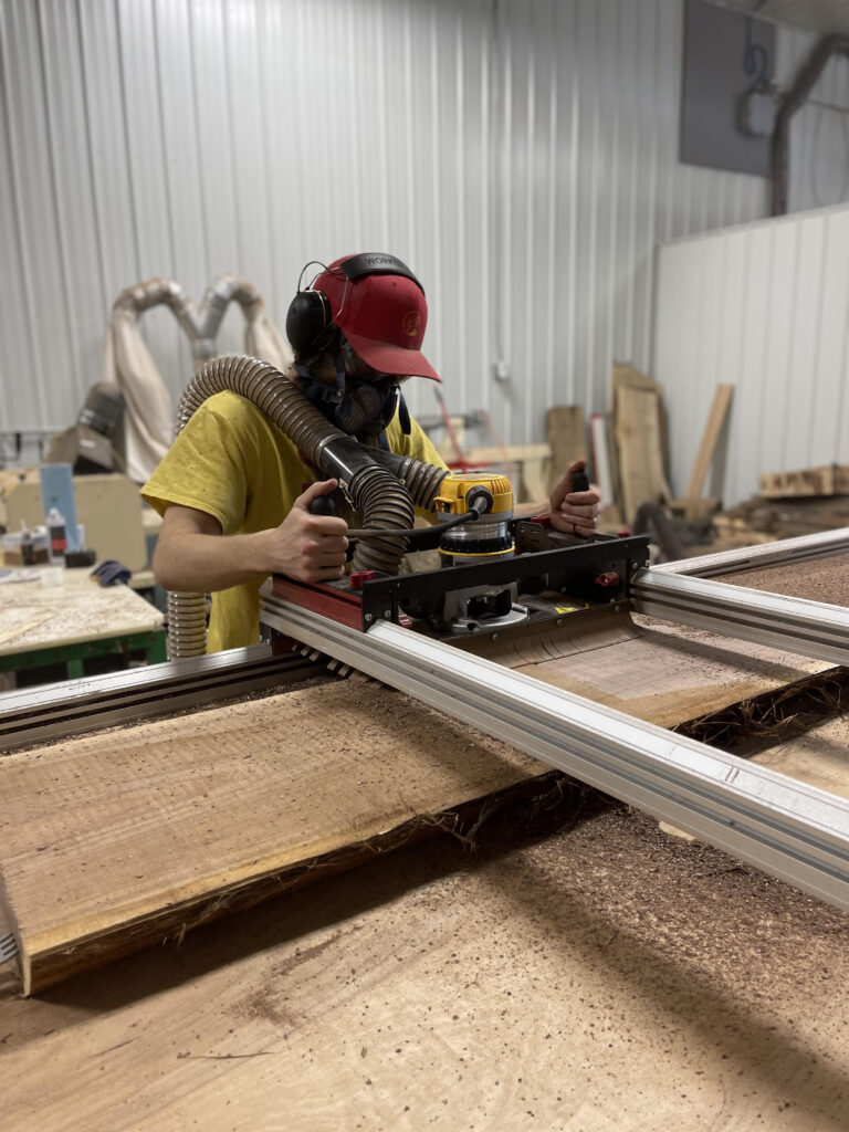 Nate Boscaljon Owner of Boscaljon Design Co. is using furniture machinery