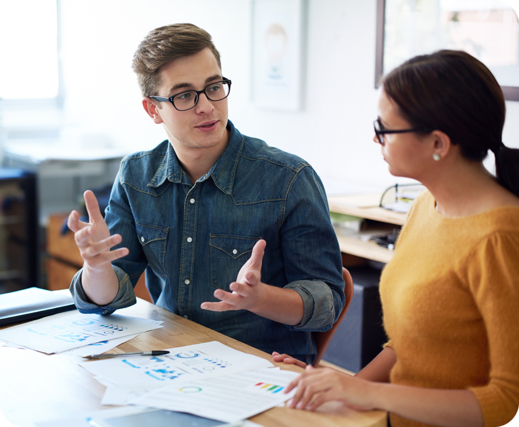 two team members in a meeting discussing accounting