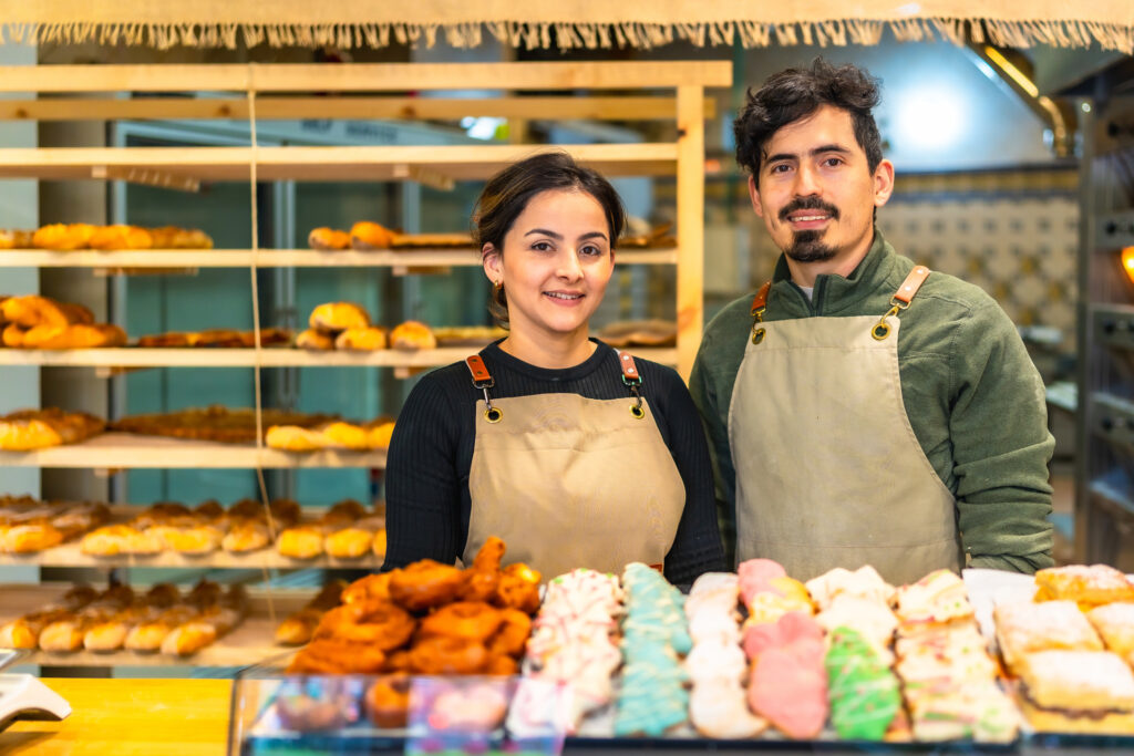 male and female young coworkers in an artisan bakery shop