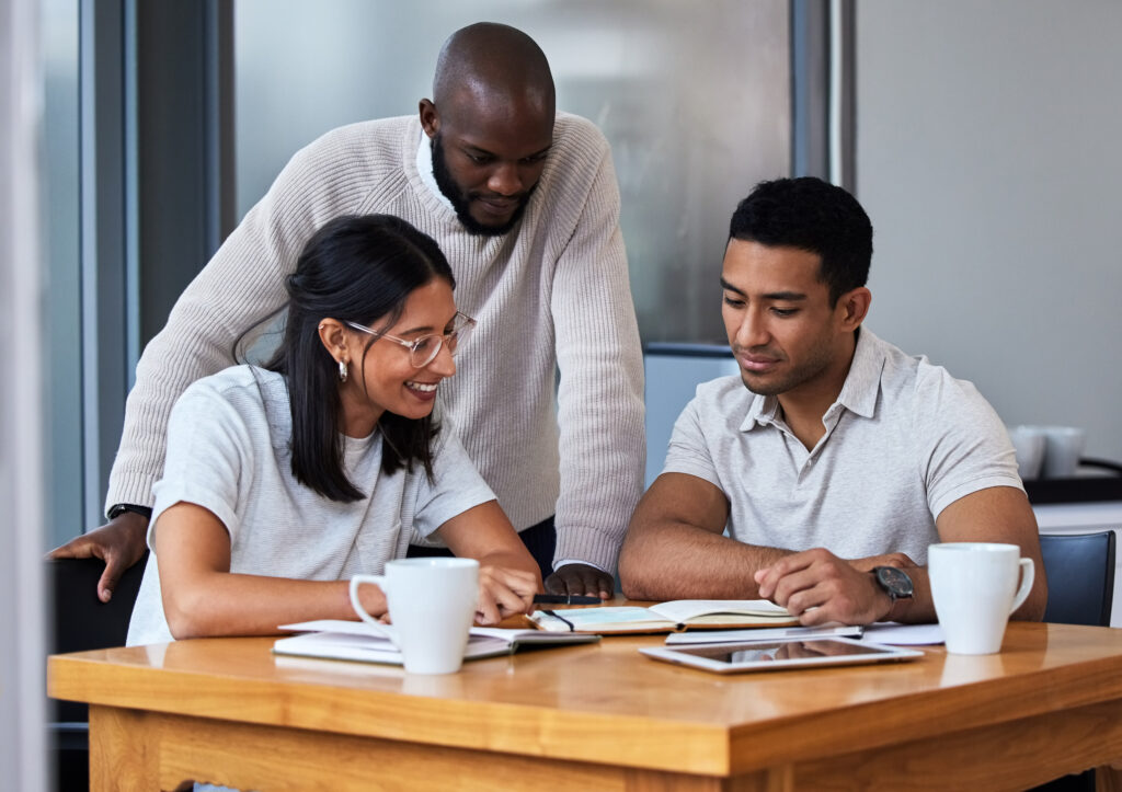 Shot of diverse group of businesspeople having a quick meeting in an office
