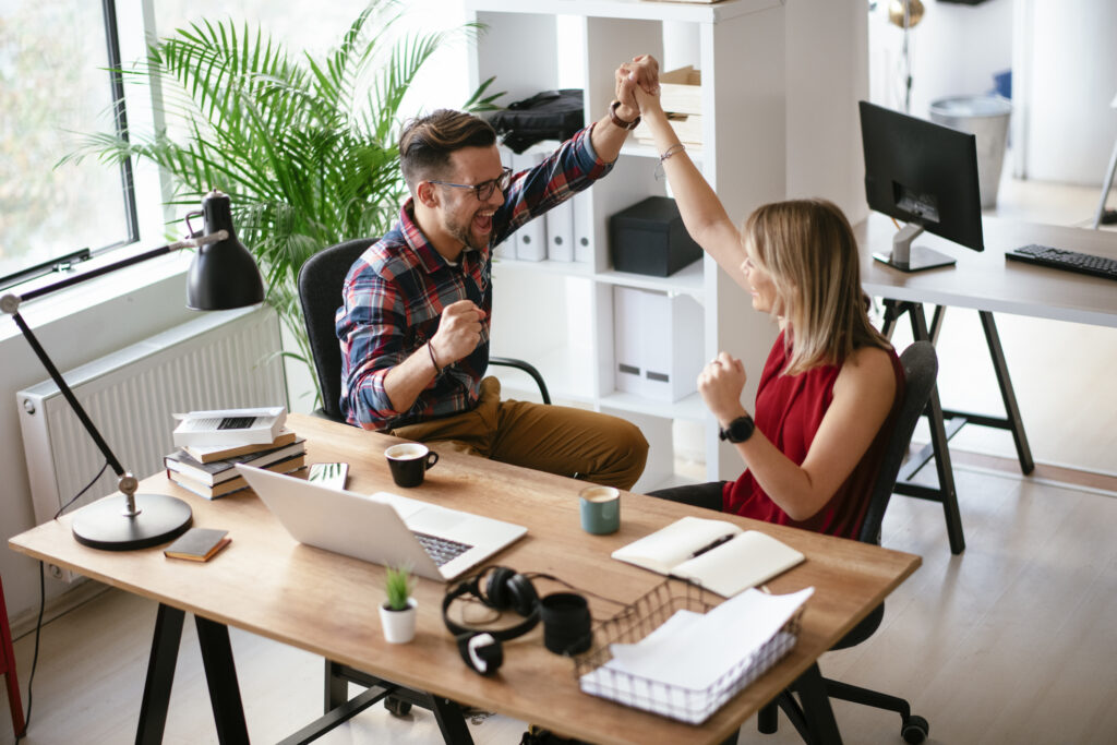 Colleagues giving each other high five
