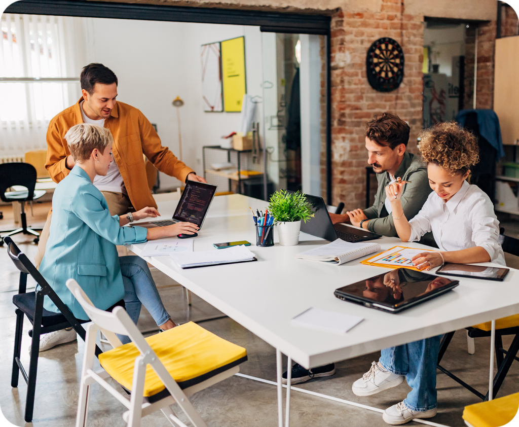 small business meeting with others sitting at a table conversing