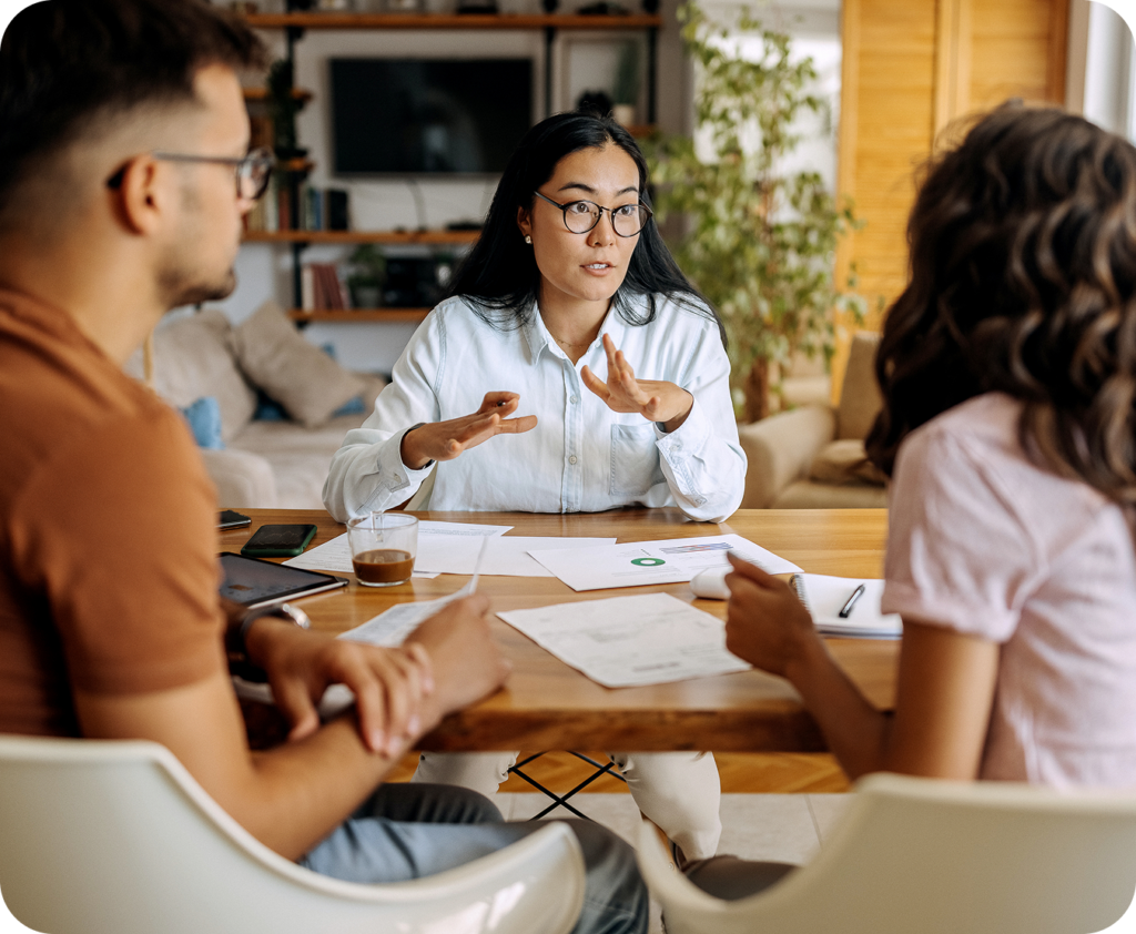 business meeting at a table with several coworkers