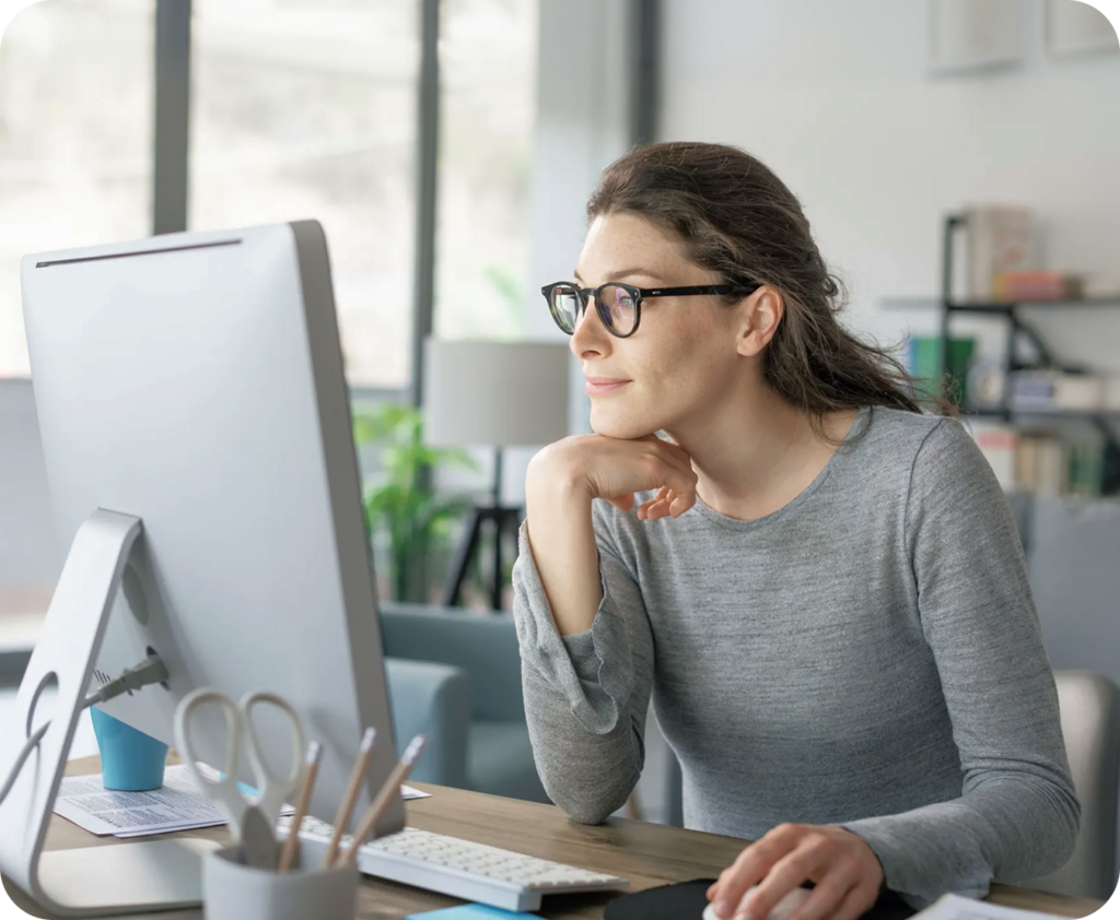 woman at her computer with her hand on her mouse